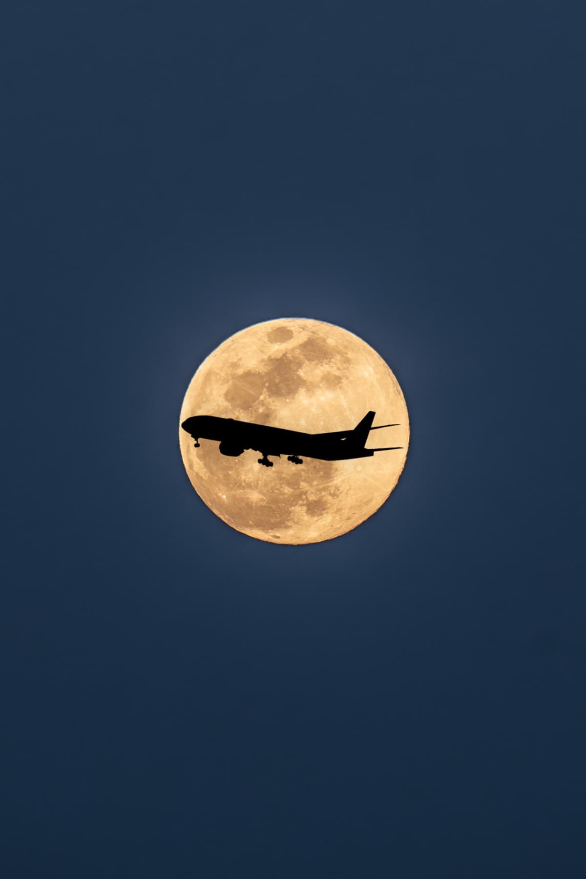 Moon with airplane silhouette