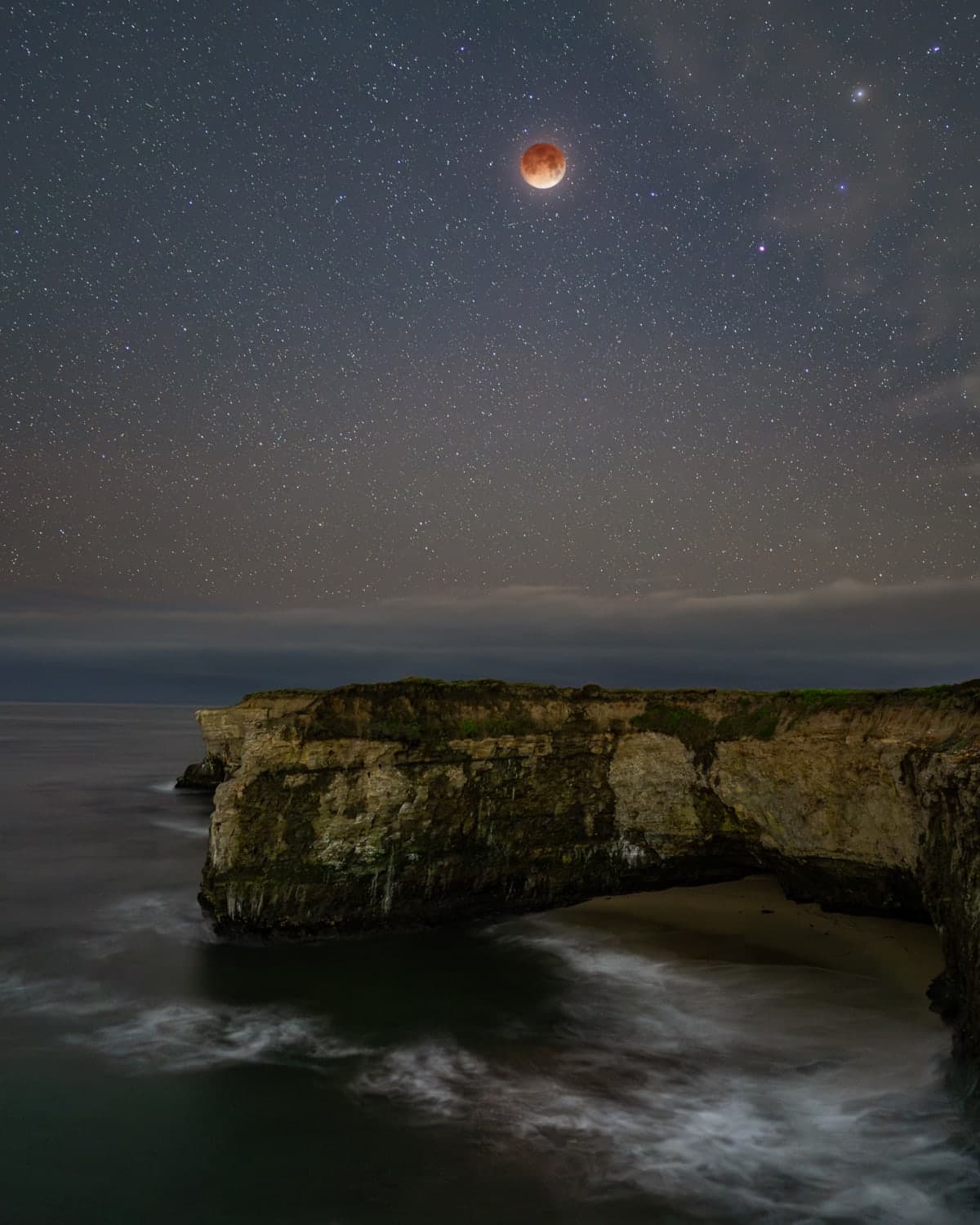 Total lunar eclipse over the coast